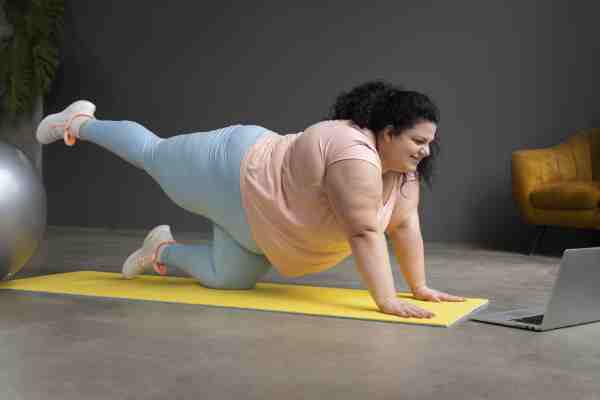 An overweight woman exercising, highlighting the benefits of regular physical activity for managing diabetes.