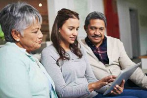 A family using a digital tablet, representing the importance of family support in managing diabetes.