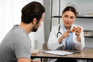 An elderly man consulting a doctor at home, stressing the need for medical guidance in type 2 diabetes.