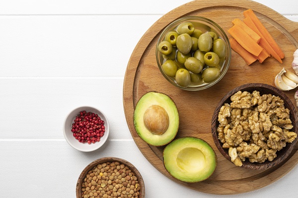 Nuts, pulses, and vegetables symbolizing the importance of protein in a diabetic diet.