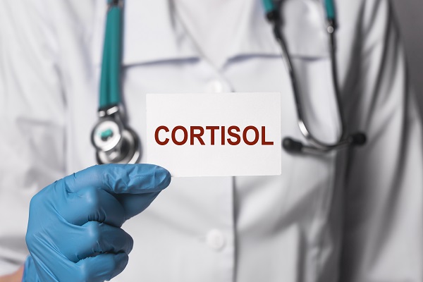 A professional showing the word 'Cortisol,' emphasizing stress hormones and insulin resistance in Type 2 Diabetes.