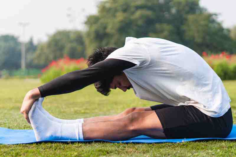 A man exercising in a park, symbolizing the importance of physical activity in improving insulin sensitivity for diabetes.