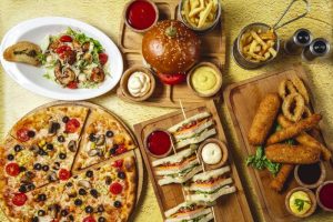 Fries, pizza, and a burger symbolizing poor dietary choices contributing to the rise of diabetes in Tamil Nadu.
