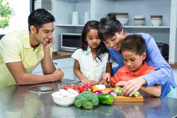 A family supporting a child with diabetes in making healthy food choices and focusing on good nutrition.