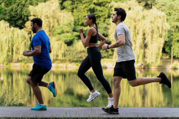 People running outdoors symbolize exercise and stress management as part of diabetes lifestyle changes.