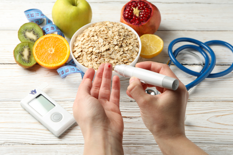 Oats, fruits, an inch tape, and a glucometer symbolize diabetes control through lifestyle changes.