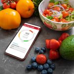 A diabetic person using a diet plan from a mobile app to manage diabetes.
