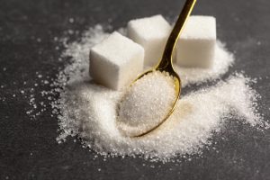 Sugar cubes and a spoonful of sugar represent sucrose, which is broken down during digestion for energy.