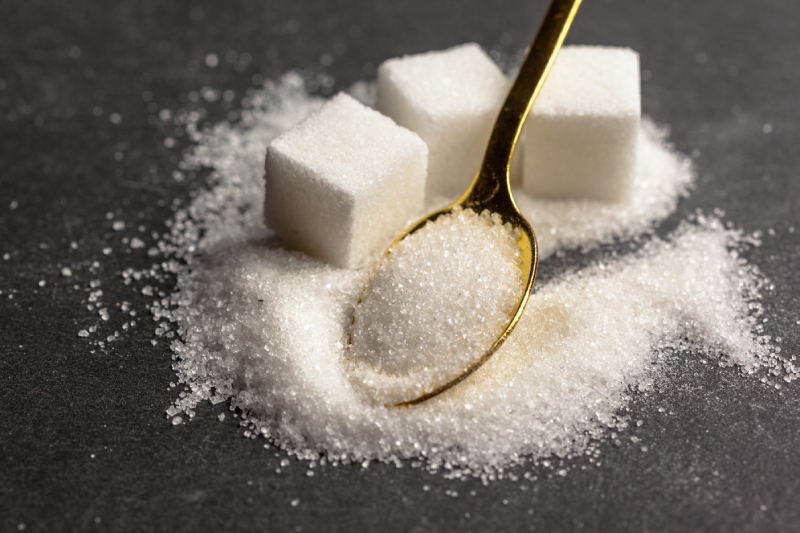 Sugar cubes and a spoonful of sugar represent sucrose, which is broken down during digestion for energy.