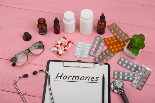 Doctor’s desk with clipboard and hormone medication, representing Type 2 diabetes as a long-term condition.