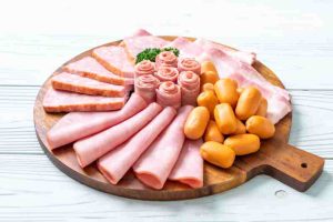 Processed meats representing foods to avoid after a heart attack.