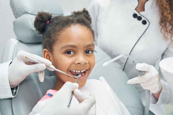 A child getting early dental check-up to prevent future issues and learn proper oral care.