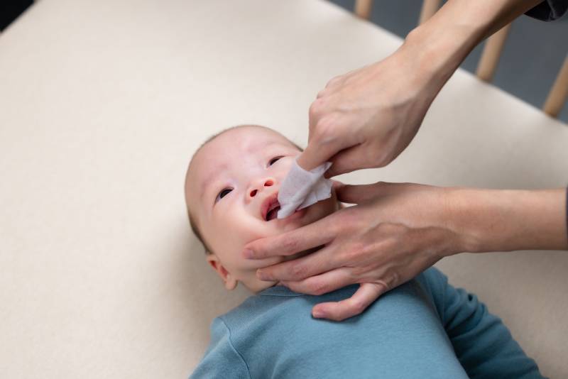 Cleaning a baby's mouth early helps prevent major dental issues by building proper oral care habits.