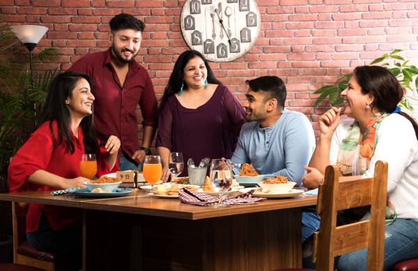 A family enjoying a meal together, emphasizing the importance of distraction-free family time.
