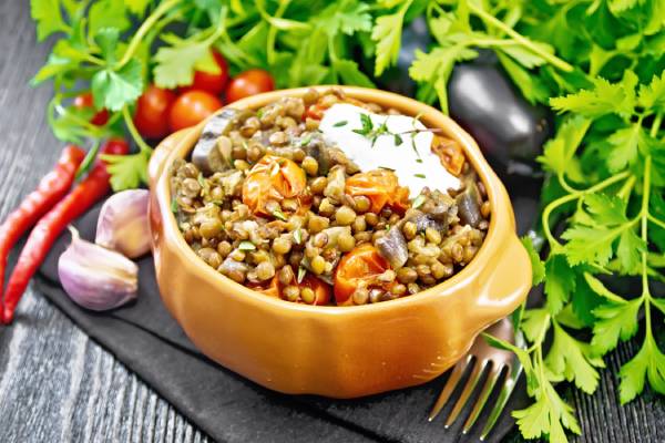 A warm bowl of sprouted lentils with tomatoes and onions, healthy and tasty evening snack