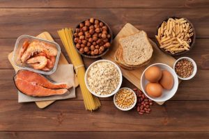 A nutrient-dense snack with protein, fiber, and complex carbs, including shrimp, pasta, and bread.