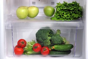 Fresh fruits and veggies in fridge, proper storage makes refrigerator a great food preservation tool.