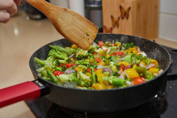 Stir-frying helps retain nutrients by cooking at high heat for a short time.