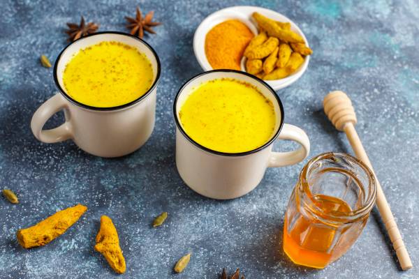 Turmeric milk with honey and spices, where black pepper boosts curcumin absorption by 2000%.