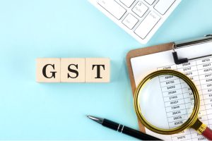 GST" blocks representing the unified tax system, replacing previous VAT and service taxes.